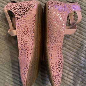 Metallic pink monkey feet shoes
